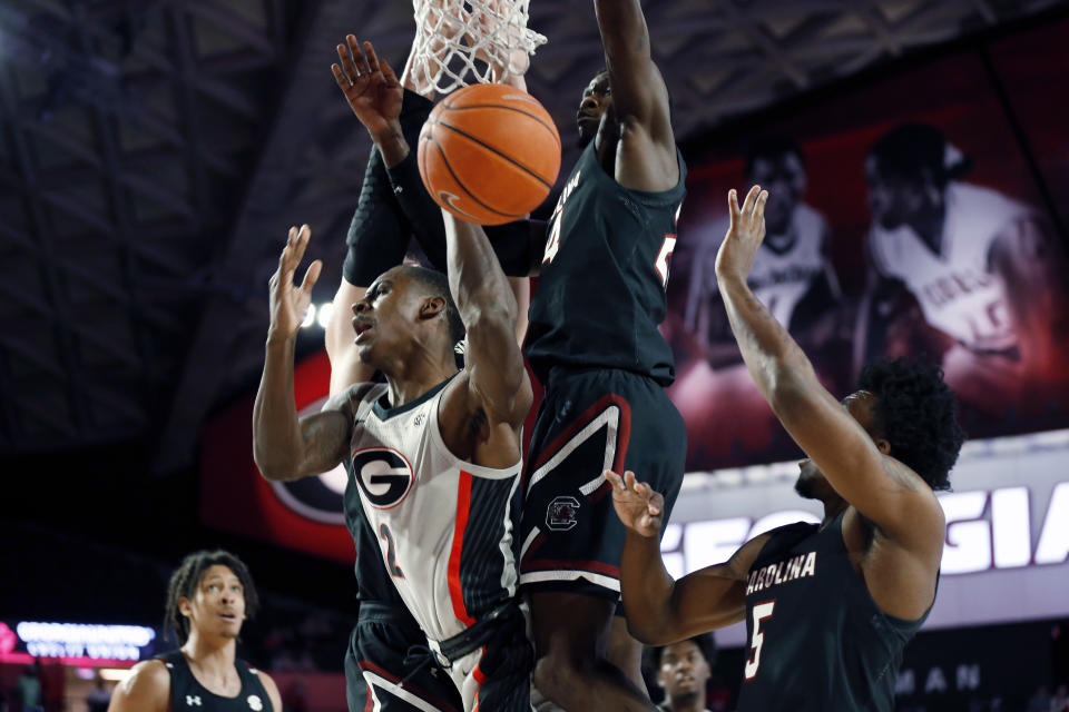 Georgia's Jordan Harris (2) is fouled by South Carolina forward Keyshawn Bryant (24) during an NCAA college basketball game Wednesday, Feb. 12, 2020, in Athens, Ga. (Joshua L. Jones/Athens Banner-Herald via AP)