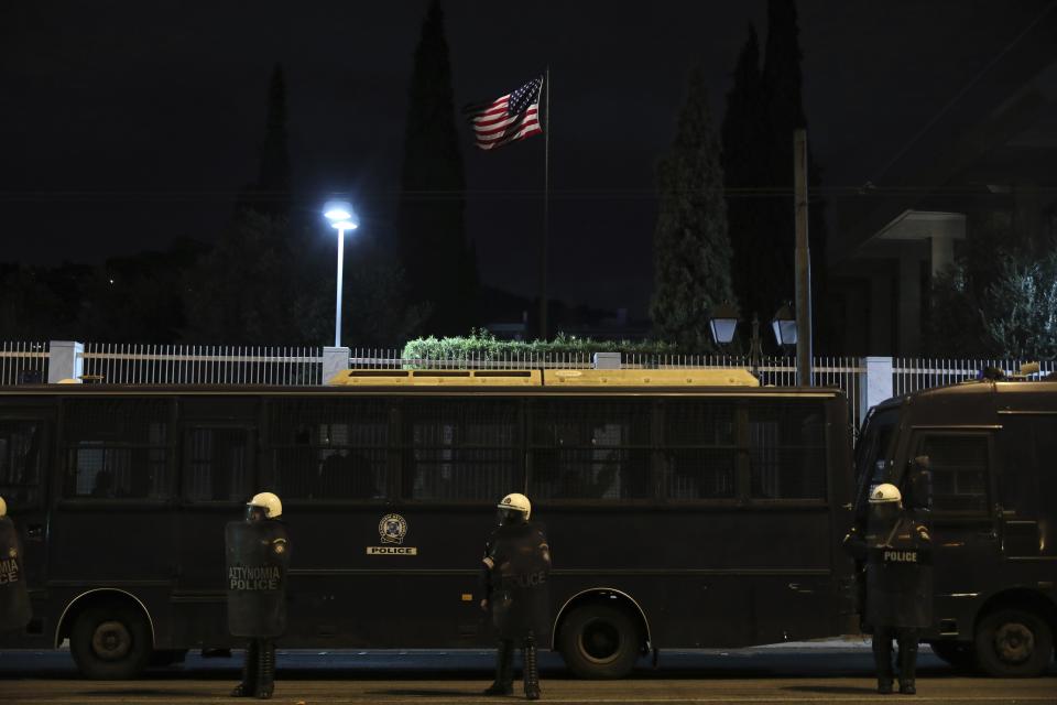 Riot police guard outside the US Embassy during a rally in Athens, Saturday, Nov. 17, 2018. Several thousands people march to the U.S. Embassy in Athens under tight police security to commemorate a 1973 student uprising that was crushed by Greece's military junta, that ruled the country from 1967-74. (AP Photo/Yorgos Karahalis)