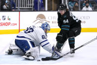 Toronto Maple Leafs goaltender Joseph Woll (60) stops a shot by San Jose Sharks left wing Alexander Barabanov (94) during the first period of an NHL hockey game Friday, Nov. 26, 2021, in San Jose, Calif. (AP Photo/Tony Avelar)