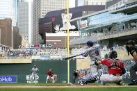 Kansas City Royals' Vinnie Pasquantino hits a two-run home run against the Minnesota Twins during the first inning of a baseball game Monday, Aug. 15, 2022, in Minneapolis. (AP Photo/Abbie Parr)