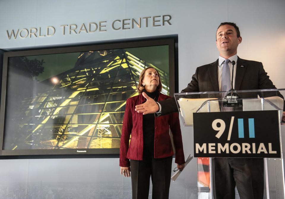 Alice Greenwald, director of the National Sept. 11 Memorial Museum, left, listens as Joseph Daniels, president of the National Sept. 11 Memorial, speak during a press conference on Friday Jan. 24, 2014 in New York. After years of delays due to funding disputes, engineering challenges and a nearly disastrous flood, the museum will open to the public in mid-May in a giant cavern beneath the World Trade Center site — with a world-class admissions price of $24. (AP Photo/Bebeto Matthews)