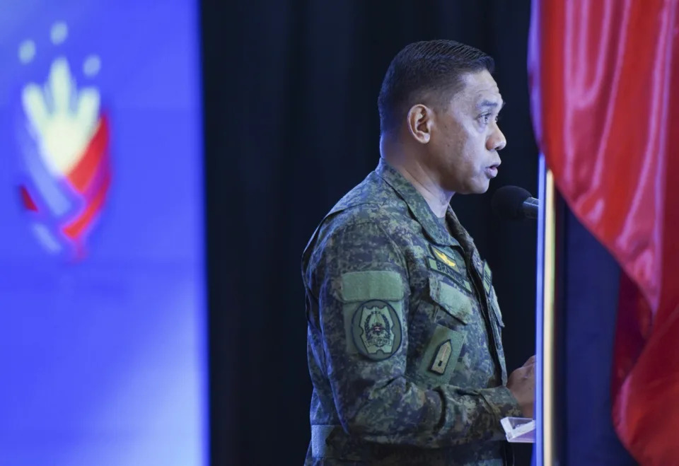 In this handout photo provided by the Armed Forces of the Philippines Public Affairs Office, Philippine military chief Gen. Romeo Brawner Jr. talks during a conference with Philippine President Ferdinand Marcos Jr. at Camp Aguinaldo military headquarters in Quezon City, Philippines on Thursday July 4, 2024. Philippine forces would defend themselves with "the same level of force" if they come under assault again from China's coast guard in the disputed South China Sea where Chinese personnel armed with machetes and spears injured Filipino navy men and damaged two of their boats in a chaotic faceoff last month, the Philippine military chief warned Thursday. (Armed Forces of the Philippines Public Affairs Office via AP)