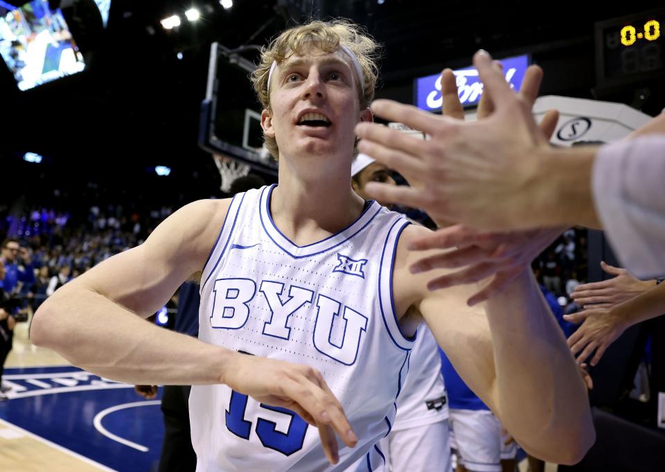 Brigham Young Cougars guard Richie Saunders (15) is congratulated by fans after BYU defeats San Diego State, 74-65, at BYU’s Marriott Center in Provo on Friday, Nov. 10, 2023. | Laura Seitz, Deseret News