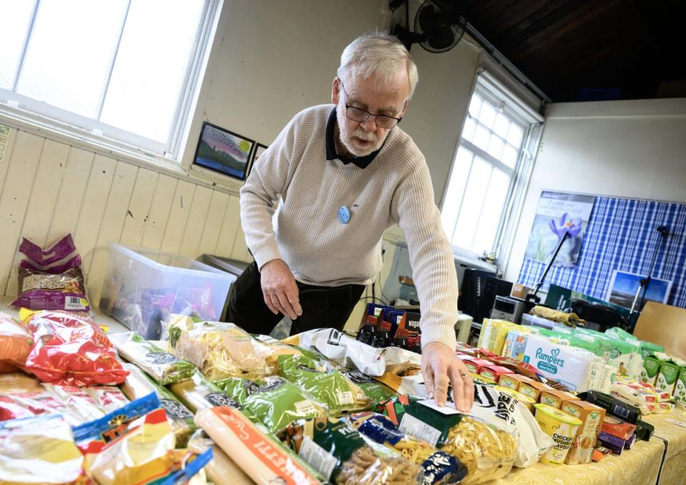 A volunteer at Bonny Downs Community Association food club during a March visit as part of Sainsbury's and Comic Relief's campaign to raise awareness of food poverty in the UK (PA)