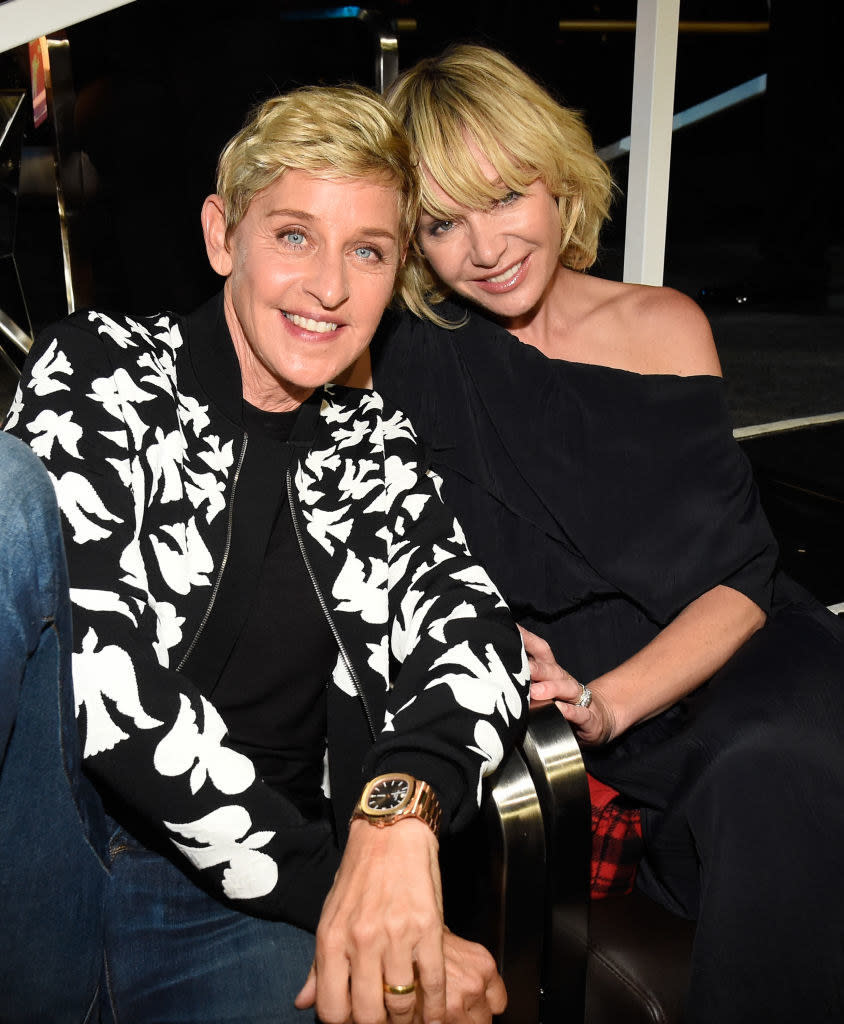 Ellen and Portia smiling and sitting together