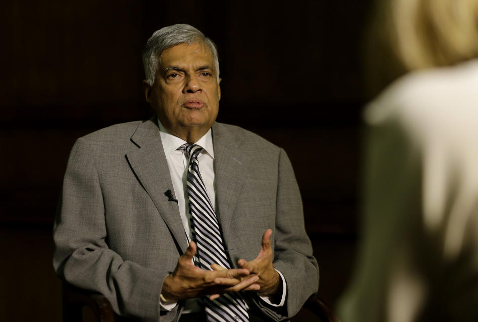 Sri Lankan Prime Minister Ranil Wickremesinghe takes a question during an interview with the Associated Press at his office in Colombo, Sri Lanka, Thursday, April 25, 2019. Wickremesinghe has acknowledged to The Associated Press that minority Ahmadi Muslims who are refugees from Pakistan have faced attacks since the Easter bombings. He said Thursday that security forces were trying to help the Ahmadis. (AP Photo/Eranga Jayawardena)