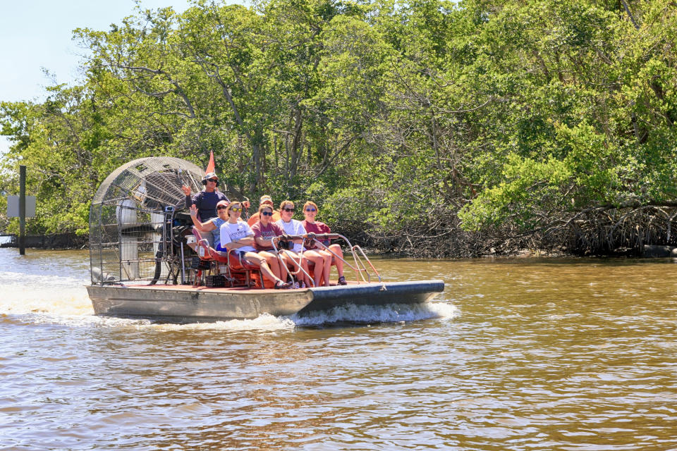 people on an airboat in the Everglades