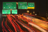 FILE - In this Nov. 24, 2020, file photo, motorists travel south along Interstates 90 and 94 in Chicago. Data from roadways and airports shows millions could not resist the urge to gather on Thanksgiving, even during a pandemic.(AP Photo/Charles Rex Arbogast, File)