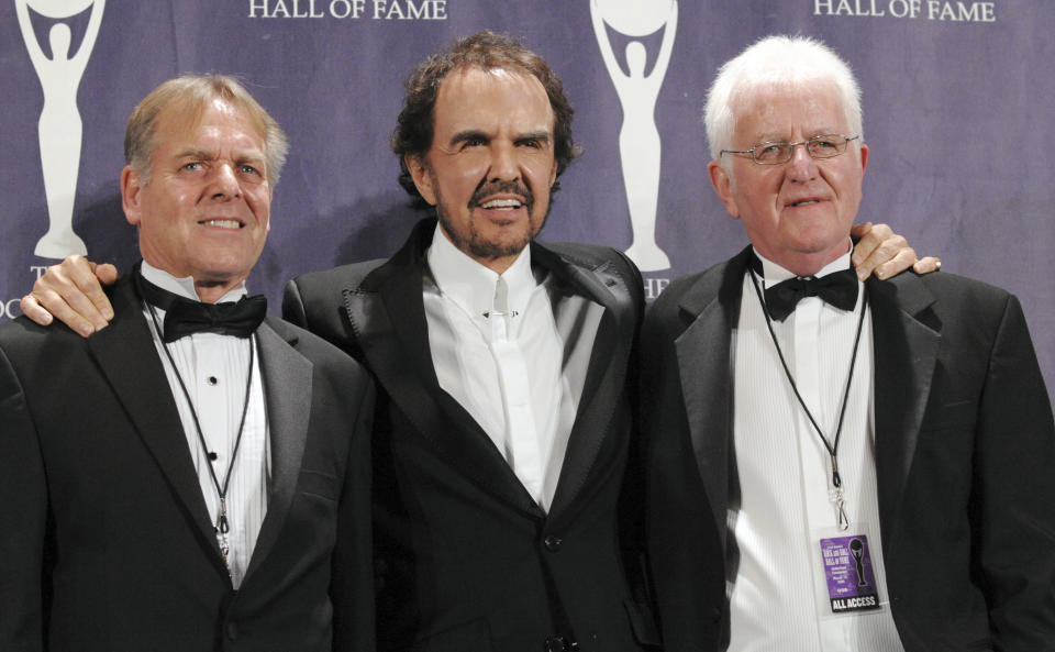 FILE - In this March 10, 2008 file photo, musicians Dave Clark, center, Lenny Davidson, left, and Rick Huxley of the British band the Dave Clark Five pose backstage at the Rock and Roll Hall of Fame Induction Ceremony, in New York. There was more to the 1960s British invasion than the Beatles, as any fan of "Catch Us If You Can" or "Because" or - get ready to shimmy - "Glad All Over." The hit tunes were among those recorded by the influential U.K. band that gets its due in "The Dave Clark Five and Beyond: Glad All Over," a PBS documentary airing Tuesday, April 8, 2014 (check local listings). (AP Photo/Evan Agostini, file)