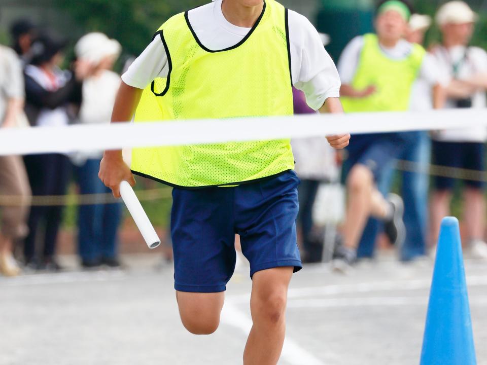 Relay anchor running at an athletic meet