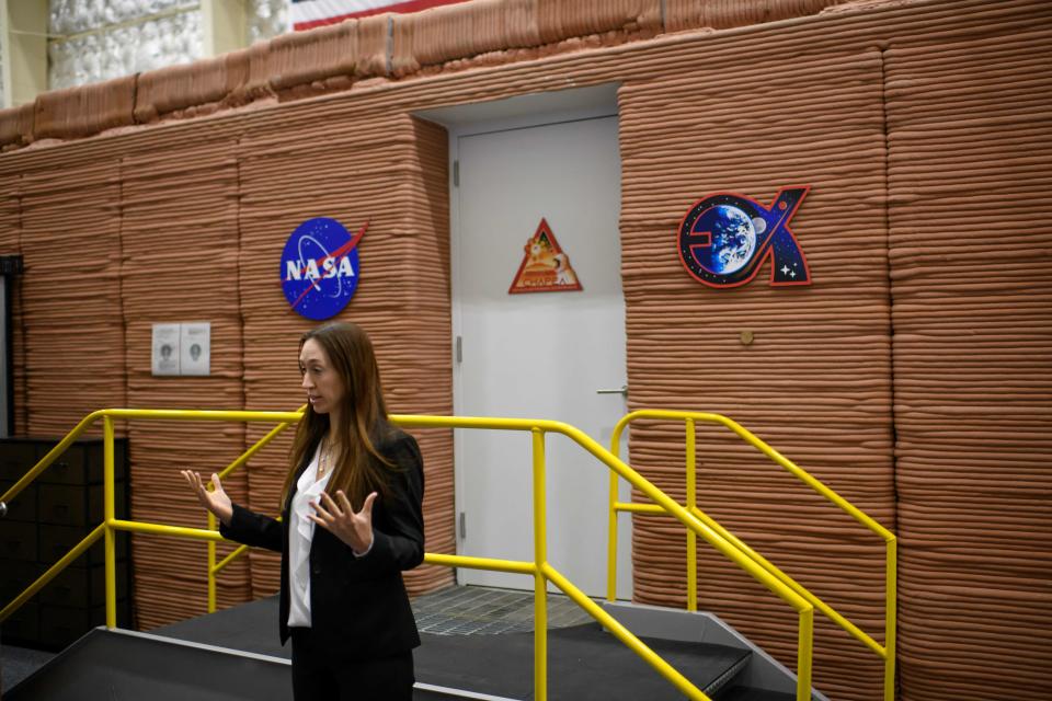 Dr. Grace Douglas, CHAPEA principal investigator, talks outside of the Mars Dune Alpha at Johnson Space center in Houston, Texas on April 11, 2023.