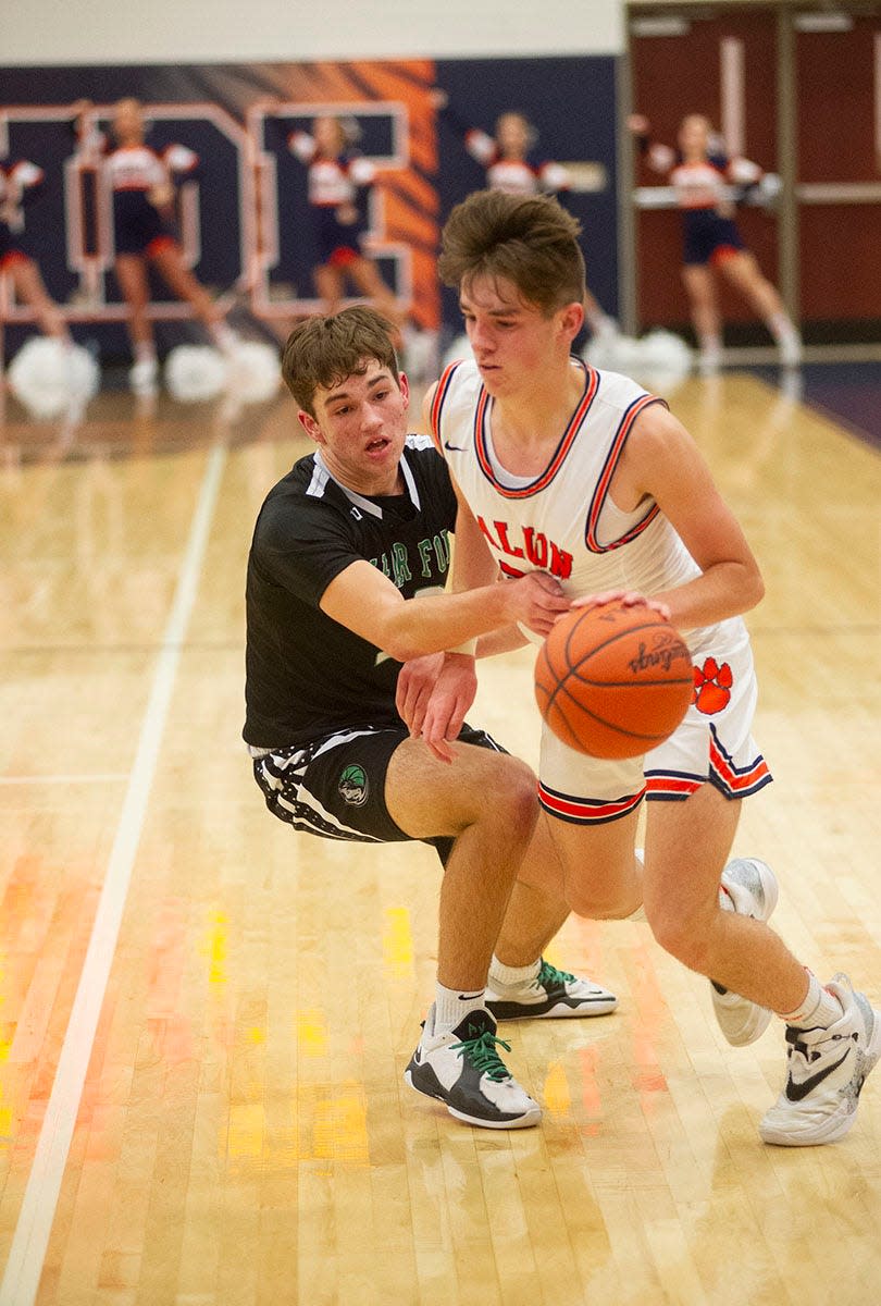 Galion's Hudson Miller drives to the basket from the corner.