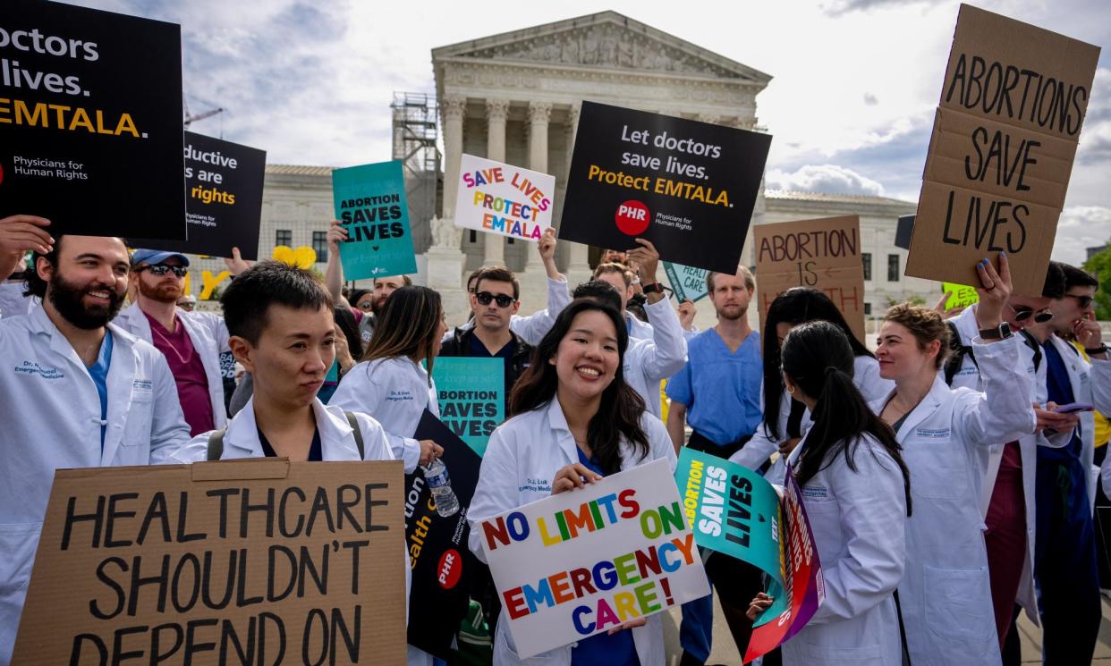 <span>A group of doctors join abortion rights supporters at a rally outside the supreme court in Washington on Wednesday.</span><span>Photograph: Andrew Harnik/Getty Images</span>