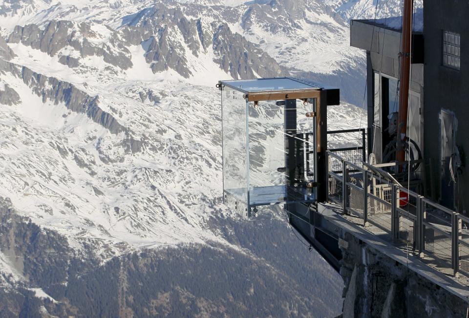 View of the 'Step into the Void' installation at the Aiguille du Midi mountain peak above Chamonix, in the French Alps, December 17, 2013. The Chamonix Skywalk is a five-sided glass structure installed on the top terrace of the Aiguille du Midi (3842m), with a 1,000 metre drop below, where visitors can step out from the terrace, giving the visitors the impression of standing in the void. The glass room will open to the public on December 21, 2013. REUTERS/Robert Pratta (FRANCE - Tags: SOCIETY TRAVEL CITYSCAPE)