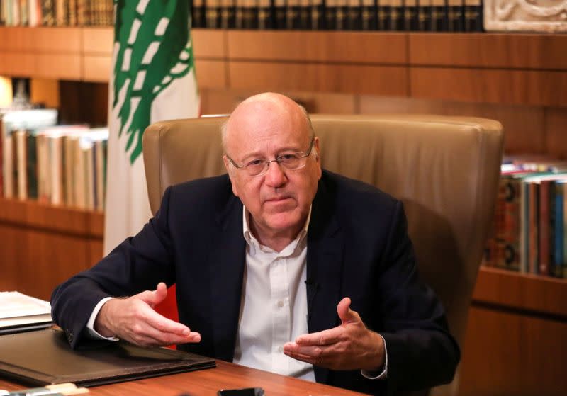 FILE PHOTO: Lebanese Prime Minister Najib Mikati speaks during an interview with Reuters at the government palace in Beirut