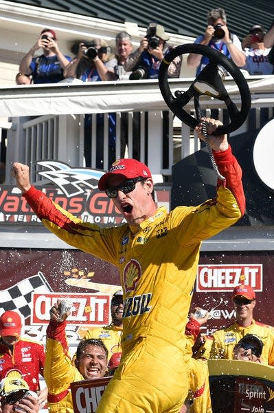 Joey Logano climbing from his winning car and holding the steering wheel has become a common visual in NASCAR.