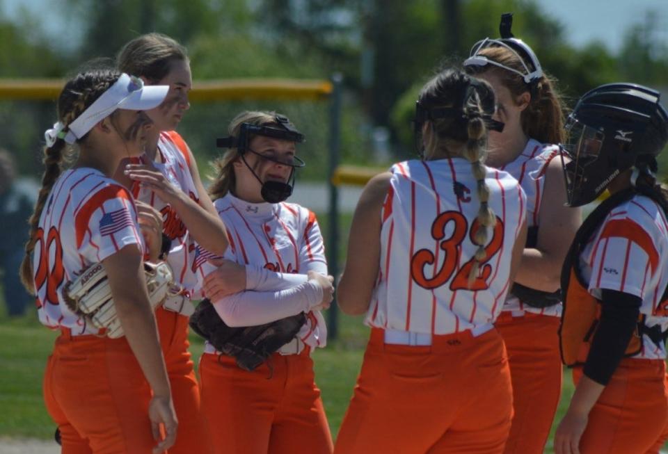 The Cheboygan Chiefs gather for a mound visit during an MHSAA Division 2 District 33 semifinal against the Escanaba Eskymos Saturday in Sault Ste. Marie.