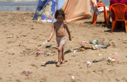 A child plays on a beach in Morocco's capital Rabat on July 12, 2018