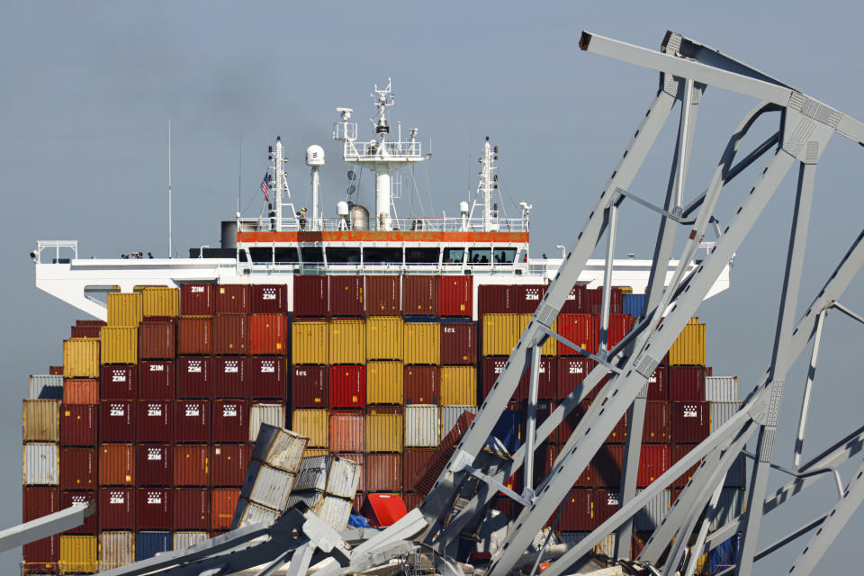 People are seen aboard the container ship Dali, Monday, April 15, 2024, in Baltimore. The FBI confirmed that agents were aboard the Dali conducting court-authorized law enforcement activity. (AP Photo/Julia Nikhinson)