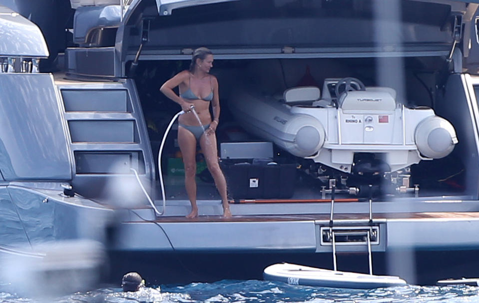 Kate Moss enjoys a holiday with friends on board a yacht in St-Tropez. Photo: Mega