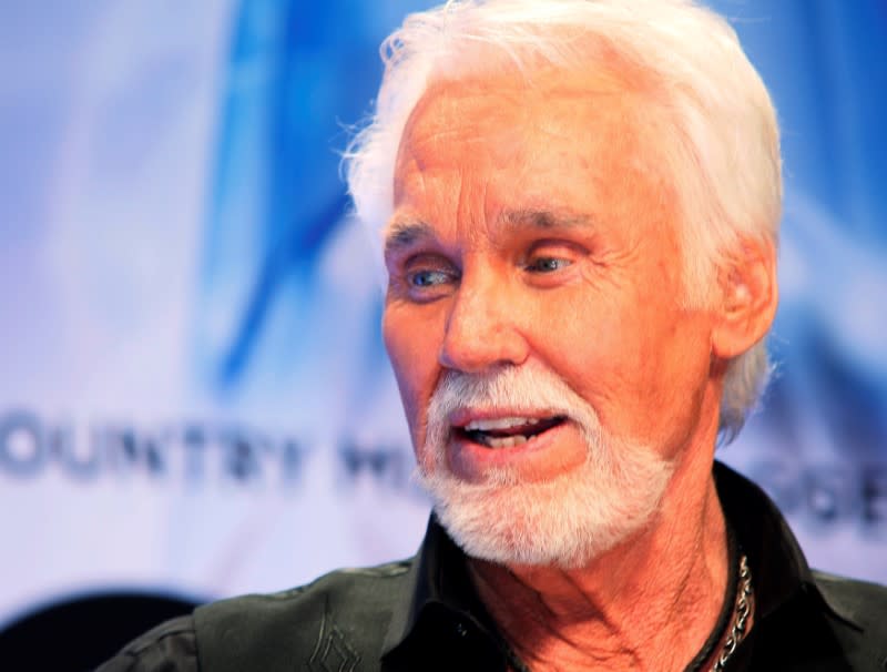 FILE PHOTO: Kenny Rogers poses backstage after accepting the Willie Nelson Lifetime Achievement award at the 47th Country Music Association Awards in Nashville