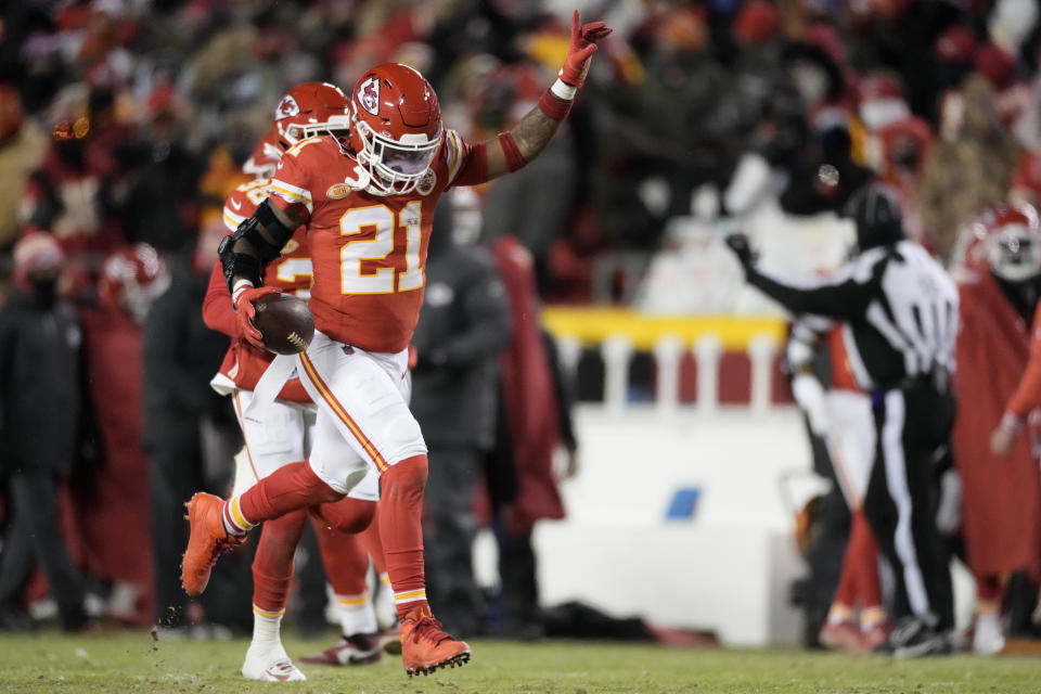 Kansas City Chiefs safety Mike Edwards (21) celebrates after intercepting a pass from Miami Dolphins quarterback Tua Tagovailoa during the first half of an NFL wild-card playoff football game Saturday, Jan. 13, 2024, in Kansas City, Mo. (AP Photo/Charlie Riedel)