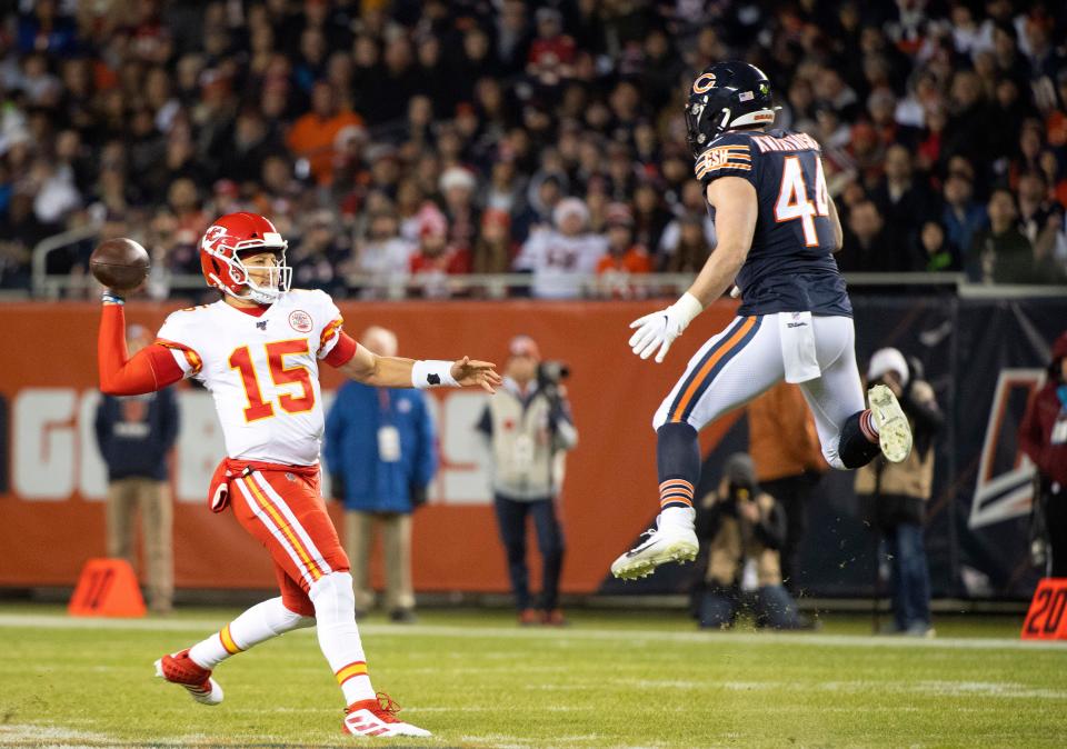 Kansas City Chiefs quarterback Patrick Mahomes (15) rushes the ball against Chicago Bears inside linebacker Nick Kwiatkoski (44) during the first half at Soldier Field.