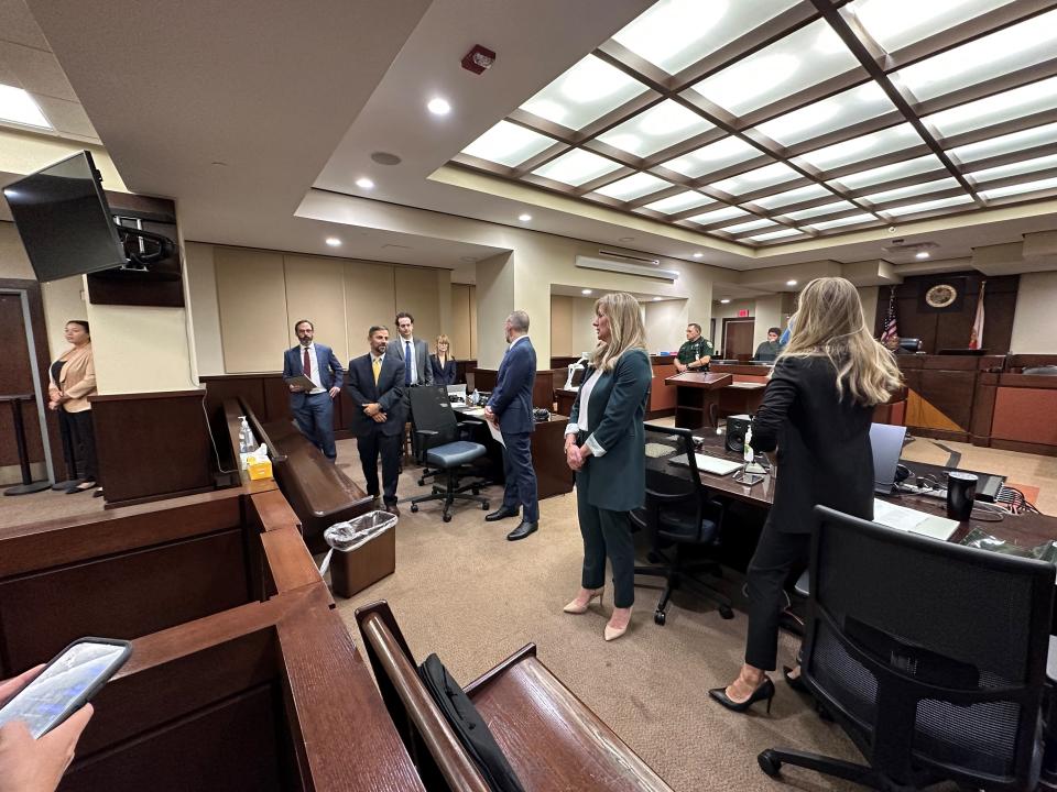 Prosecutors, defense attorneys and Charlie Adelson rise as prospective jurors enter the courtroom on the first day of jury selection Monday, Oct. 23, 2023. Adelson, third from left, stands with his defense team, including Daniel Rashbaum and Josh Dubin. Pictured on the right are Assistant State Attorneys Georgia Cappleman and Sarah Kathryn Dugan.