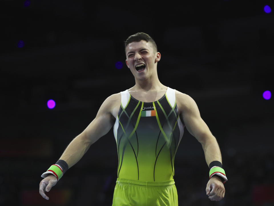 Bronze medalist Rhys McClenaghan of Ireland celebrates after his performance on the pommel horse in the men's apparatus finals at the Gymnastics World Championships in Stuttgart, Germany, Saturday, Oct. 12, 2019. (AP Photo/Matthias Schrader)