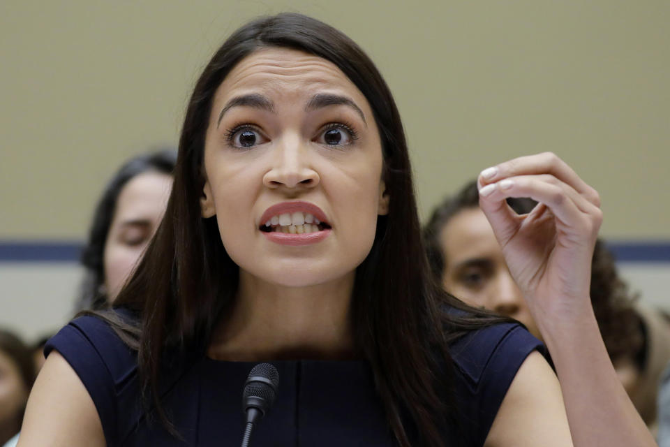 FILE - In this Friday, July 12, 2019, file photo, Rep. Alexandria Ocasio-Cortez, D-NY., gestures while testifying before the House Oversight Committee hearing on family separation and detention centers, on Capitol Hill in Washington. In tweets Sunday, President Donald Trump portrays the lawmakers as foreign-born troublemakers who should go back to their home countries. In fact, the lawmakers, except one, were born in the U.S. He didn’t identify the women but was referring to Reps. Alexandria Ocasio-Cortez, Ilhan Omar, Ayanna Pressley and Rashida Tlaib. (AP Photo/Pablo Martinez Monsivais, File)