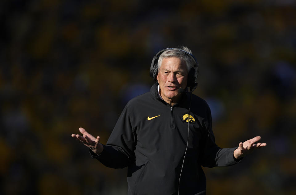 Iowa head coach Kirk Ferentz looks to an official for a touchdown ruling during the first half of an NCAA college football game against Minnesota, Saturday, Oct. 21, 2023, in Iowa City, Iowa. (AP Photo/Matthew Putney)