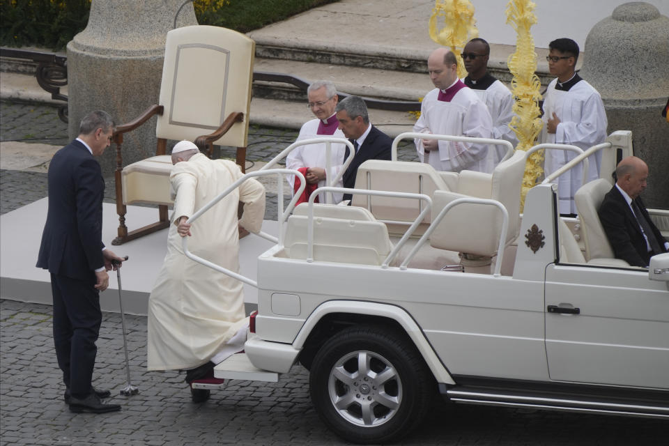 Pope Francis arrives to celebrate the Palm Sunday's mass in St. Peter's Square at The Vatican Sunday, April 2, 2023 a day after being discharged from the Agostino Gemelli University Hospital in Rome, where he has been treated for bronchitis, The Vatican said. The Roman Catholic Church enters Holy Week, retracing the story of the crucifixion of Jesus and his resurrection three days later on Easter Sunday. (AP Photo/Gregorio Borgia)