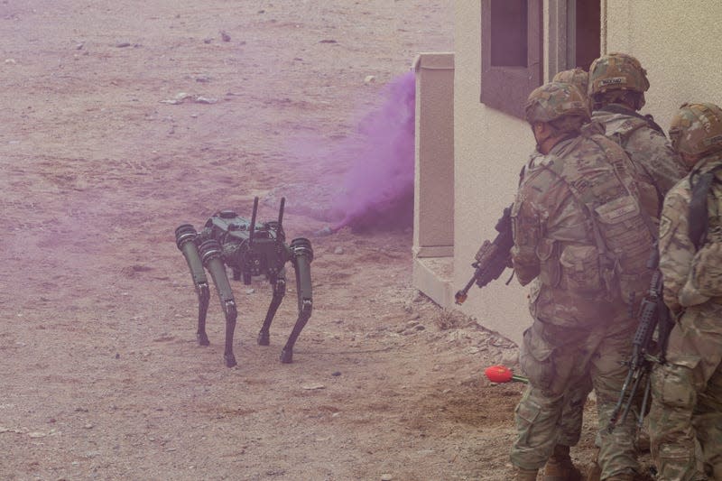 U.S. Soldiers assigned to the 1st Battalion, 29th Infantry Regiment, based out of Fort Moore, Ga., take part in a human machine integration experiment using the Ghost Robotic Dog during a demonstration of new U.S. Army capabilities at Project Convergence - Capstone 4 in Fort Irwin, Calif., March 17, 2024. - Photo: U.S. Army photo by Spc. Samarion Hicks