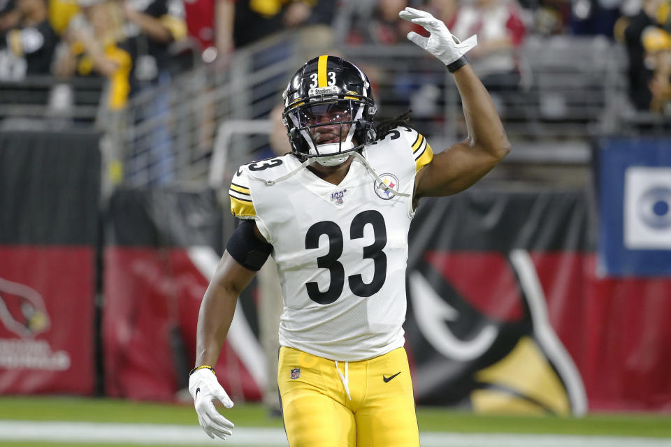 FILE - In this Dec. 8, 2019, file photo, Pittsburgh Steelers running back Trey Edmunds (33) gestures during an NFL football game against the Arizona Cardinals, in Glendale, Ariz. Ferrell and Felicia Edmunds can't lose. Nor can they be prouder when the Pittsburgh Steelers host the Buffalo Bills on Sunday night Dec. 15. It's a game that will feature all three of the Edmunds' sons _ the Steelers' Terrell and Trey Edmunds and the Bills' Tremaine _ facing off against each other. (AP Photo/Rick Scuteri, File)