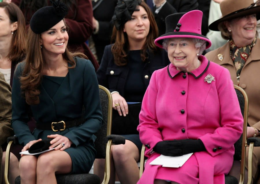 FILE – Britain’s Queen Elizabeth II, right, and Catherine, Duchess of Cambridge watch a fashion show at De Montfort University in Leicester, England, Thursday March 8, 2012. (AP Photo/Oli Scarff, Pool, File)