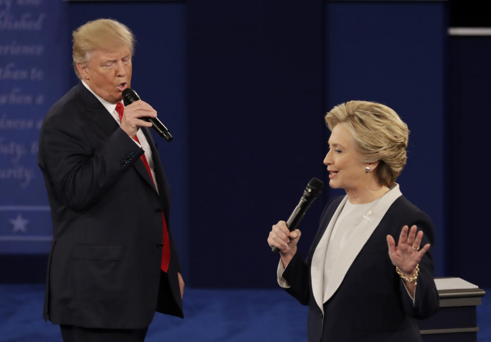 FILE - In this Oct. 9, 2016, file photo Republican presidential nominee Donald Trump and Democratic presidential nominee Hillary Clinton speak during the second presidential debate at Washington University in St. Louis. The second 2016 presidential debate was two days after the release of the 2005 “Access Hollywood” tape of Trump boasting about grabbing women by the genitals, and Trump was determined to change the narrative. (AP Photo/Patrick Semansky, File)