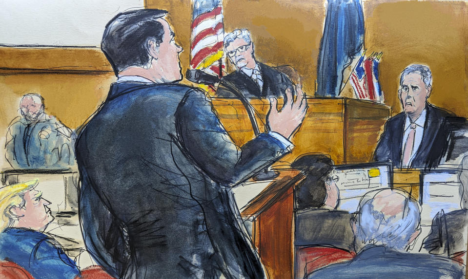 Donald Trump, far left, watches as defense attorney Todd Blanche, at podium, cross examines Michael Cohen on the witness stand with Judge Juan Merchan presiding in Manhattan criminal court, Monday, May 20, 2024, in New York. (Elizabeth Williams via AP)