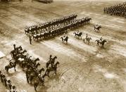 <p>Guards march past the saluting base.</p>