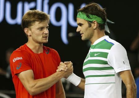 Switzerland's Roger Federer (R) shakes hands with Belgium's David Goffin after Federer won their fourth round match at the Australian Open tennis tournament at Melbourne Park, Australia, January 24, 2016. REUTERS/Brandon Malone