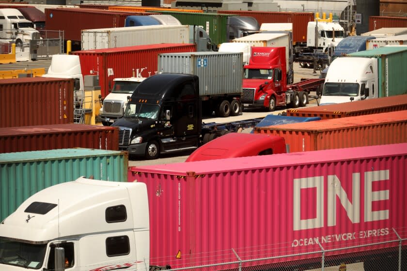 WILMINGTON, CA - AUGUST 27, 2020 - -Trucks line up to drop off their loads at the Port of Los Angeles in August 27, 2020. California air quality officials are poised to adopt their biggest pollution-cutting regulations in more than a decade, targeting diesel trucks and cargo ships that spew much of the state's cancer-causing and smog-forming emissions. The state Air Resources Board is expected to vote after a public hearing Thursday on two rules: one to establish stringent new emissions standards for heavy-duty diesel trucks and one to reduce pollution from ships docked at ports. (Genaro Molina/Los Angeles Times)