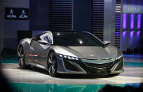 Announcing the rebirth of the Honda NSX, one of the most iconic sports cars of the 1990s, which will return in 2015 an American-built, rear-engined Acura with all-wheel-drive. Here's something to get excited for. The NSX represented the pinnacle of Honda's sports heyday of the 1980s and '90s. Launched with input from Formula One great Ayrton Senna, the NSX set a brace of technological firsts -- from its aluminum monocoque frame to the variable valve timing that would become a standard on engines worldwide. The NSX wasn't the fastest or most-powerful supercar, but reflected Honda's balance between power, weight and handling -- a sweet spot that few cars have ever acheived.