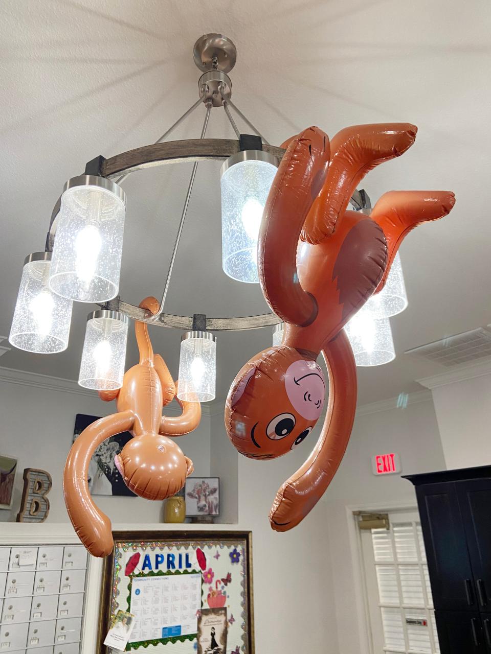 Staff at Brookdale Shawnee assisted living center paid homage to the "flying monkeys" in "The Wizard of Oz" by hanging inflatable monkeys from the light fixtures during a party marking the one-year anniversary of a tornado that struck portions of Shawnee.