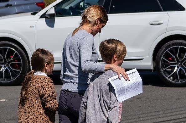NASHVILLE, TN - MARCH 27:  A parent walks with their kids from Woodmont Baptist Church where children were reunited with their families after a mass shooting at The Covenant School on March 27, 2023 in Nashville, Tennessee. According to initial reports, three students and three adults were killed by the shooter, a 28-year-old woman. The shooter was killed by police responding to the scene. (Photo by Seth Herald/Getty Images)