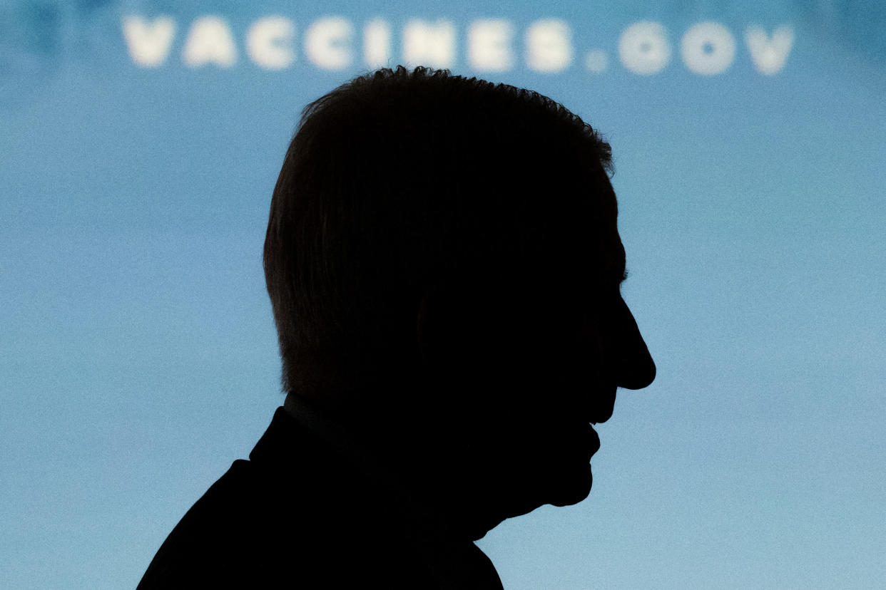 The silhouette of Dr. Anthony Fauci against a blue background.