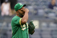 Oakland Athletics relief pitcher Yusmeiro Petit reacts after giving up a game-tying RBI single to New York Yankees' Giancarlo Stanton in the seventh inning of a baseball game, Saturday, June 19, 2021, in New York. (AP Photo/John Minchillo)