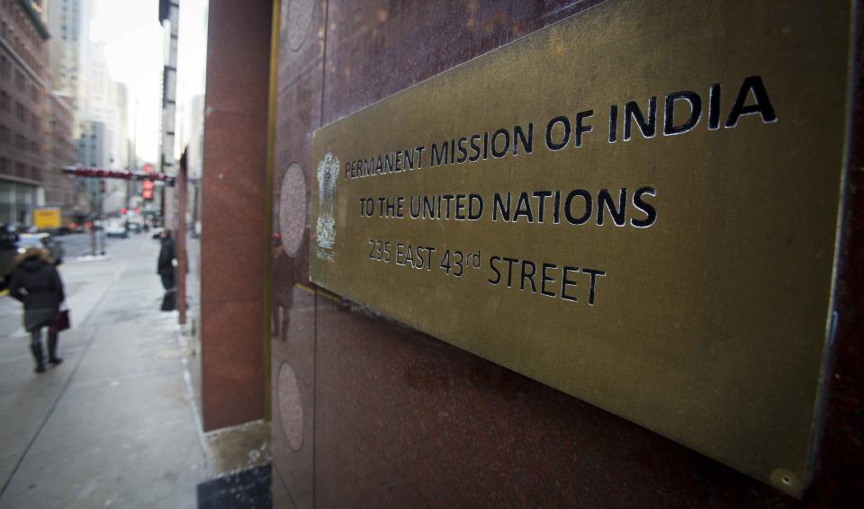 People walk past the Indian Mission to the United Nations building in New York