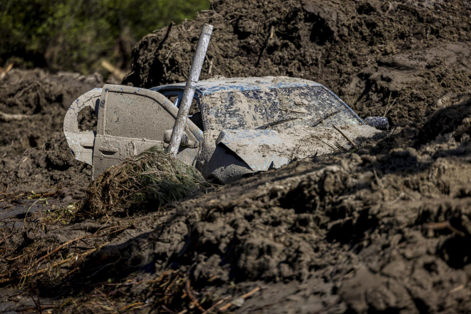 A car sits semi-submerged in mud from Cyclone Gabrielle, in Rissington, near Napier, New Zealand, Sunday Feb. 19, 2023. Cyclone Gabrielle struck the country's north on Feb. 13 and the level of damage has been compared to Cyclone Bola in 1988. That storm was the most destructive on record to hit the nation of 5 million people. (Mike Scott/NZ Herald via AP)