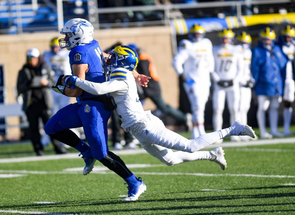 Delaware’s Amonte Strothers attempts to tackle South Dakota State quarterback Mark Gronowski at Dana J. Dykhouse Stadium in Brookings Saturday.