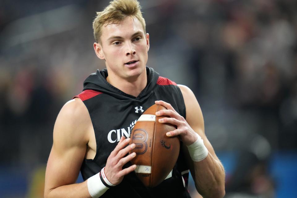 Cincinnati Bearcats wide receiver Alec Pierce (12) collects a pass during warm ups ahead in the of the College Football Playoff semifinal game against the Alabama Crimson Tide at the 86th Cotton Bowl Classic, Friday, Dec. 31, 2021, at AT&T Stadium in Arlington, Texas.