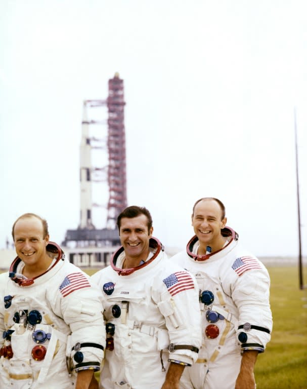 Alan Bean (R), pictured in November 1969 with his fellow US astronauts of Apollo 12, Charles "Pete" Conrad, Jr. (L), commander, and Richard F. Gordon, command module pilot (C), in front of their Saturn V space vehicle